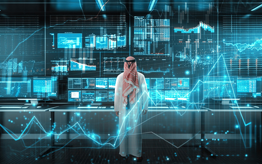 Muslim businessman working with floating data visualization screen. Futuristic business concept