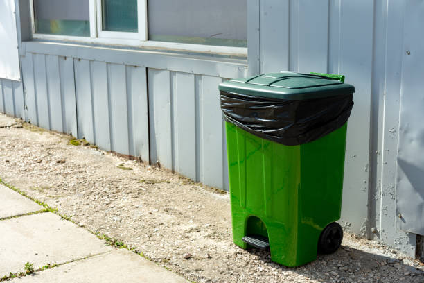 istock Green plastic garbage container standing in the street 1490490895
