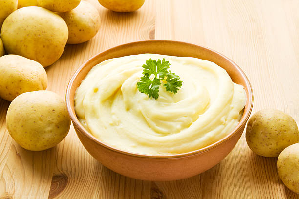 Mashed potatoes Bowl with mashed potatoes decorated with potatoes. mashed potatoes stock pictures, royalty-free photos & images