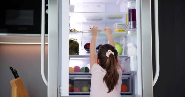 istock Child Girl Taking Food Fridge 1490494064