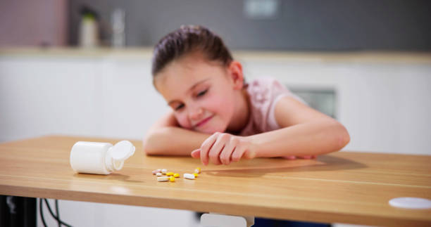 istock Child Reaching Medicine. Domestic Kid Accident 1490494069