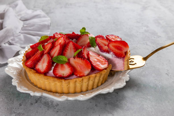 istock Homemade tart with fresh strawberries close-up. 1490494113