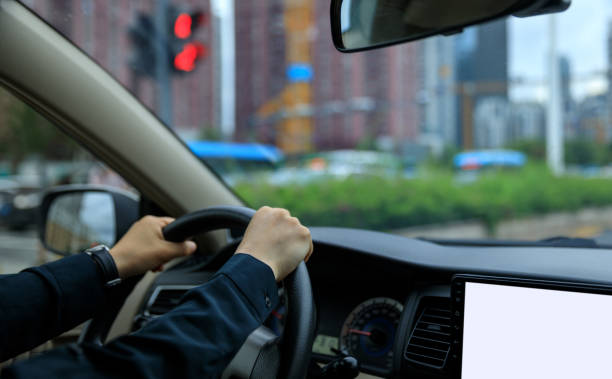 istock People driving car on city road 1490494391