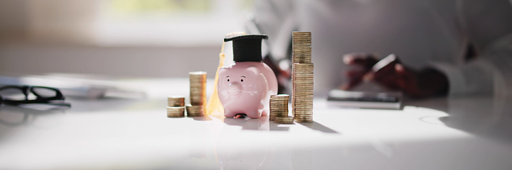 College Piggy Bank With Graduation Hat. Education Piggybank