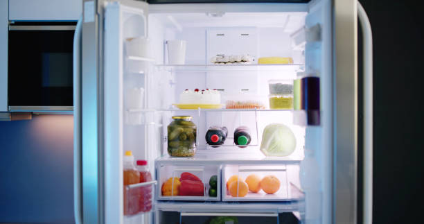 istock Open Refrigerator Full Of Juice And Fresh Vegetables 1490497309