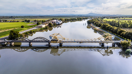 High quality aerial stock photo of the Isleton bridge crossing the Sacramento river near Rio Vista California.