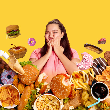 Overweight happy woman over bright yellow background around many burgers, sweets and unhealthy food. Contemporary art collage. Concept of food, creativity, junk and fast food. Modern design