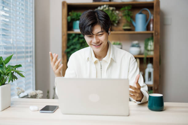 istock Asian white-collar workers use laptops at home for video conferencing 1490507168