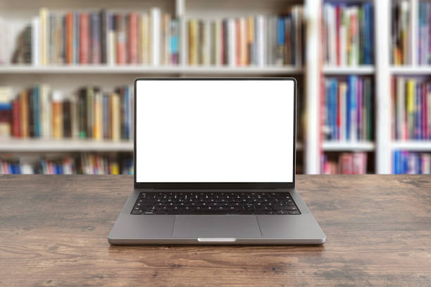 istock modern laptop computer on wooden table against bookshelf 1490507486