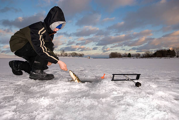 istock Young Boy Ice Fishing 149050967