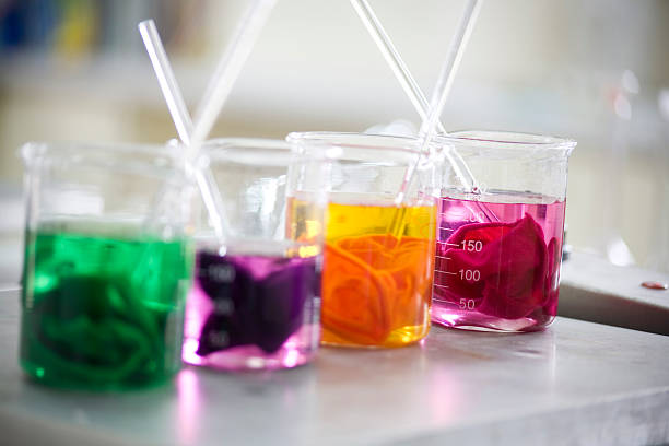 Lab equipment Color textile dyes in the lab. dye stock pictures, royalty-free photos & images