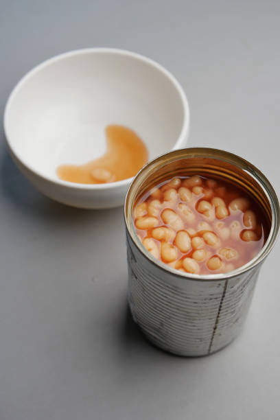 istock preserved canned tomato beans pouring into a bowl 1490516967