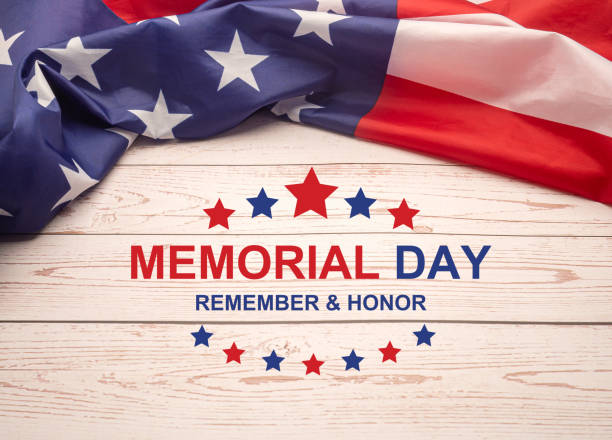 istock American flag with the text Memorial day, remember and honor on a wooden table 1490518842