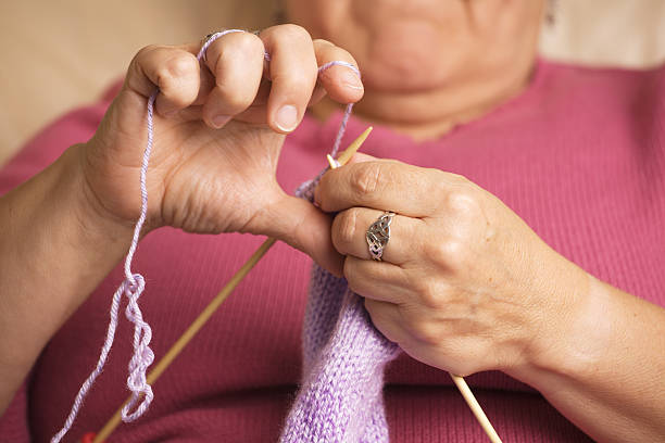 istock Closeup of hands knitting 149051923