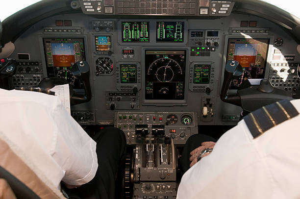 Corporate jet cockpit view with digital instruments stock photo