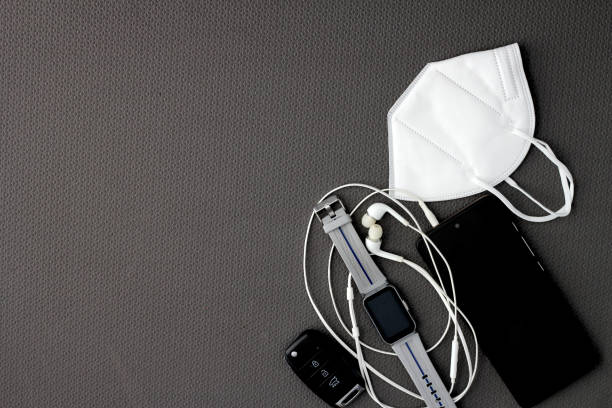 istock Fit objects to exercise in the gym prepared and protected such as a cell phone, watch, headphones and face masks to avoid contagion 1490526905