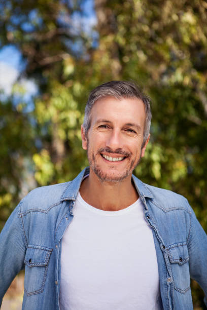 istock Cheerful midle aged man with looking at the camera 1490529977