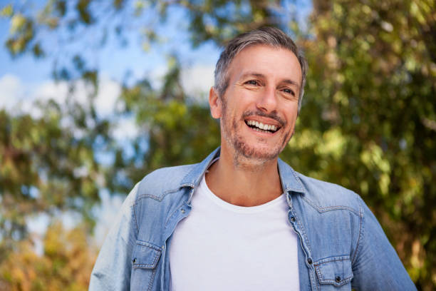 istock Portrait of man smiling while standing outdoors 1490529982