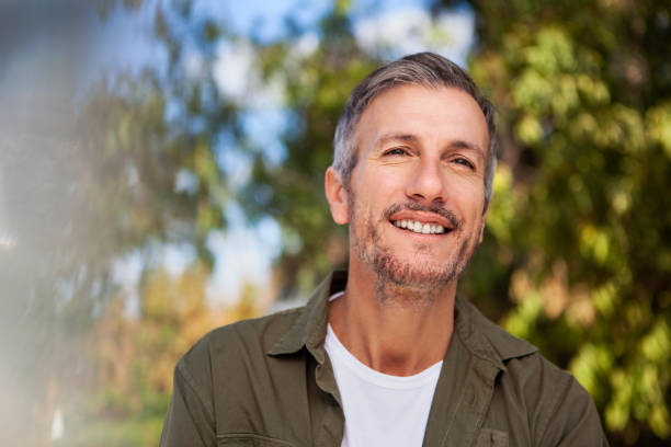 istock Middle-aged man with serene smile looking into the distance 1490530026