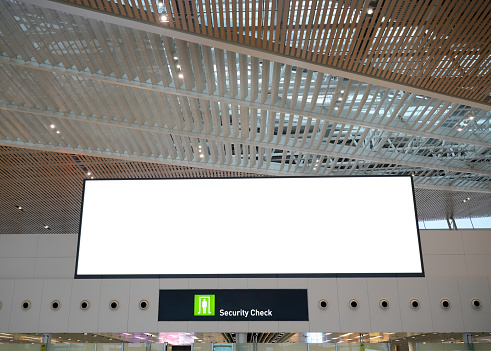 Large LED screens at airport security checkpoints