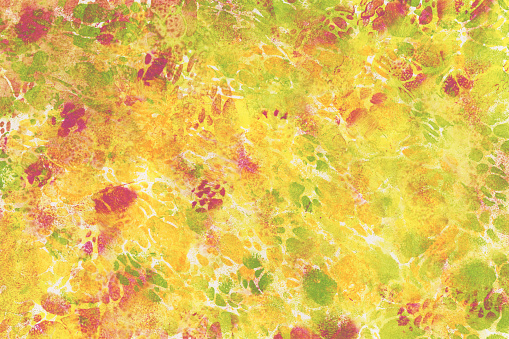 Colorful abstract pattern. Painted background in the colors yellow, green, orange and pink