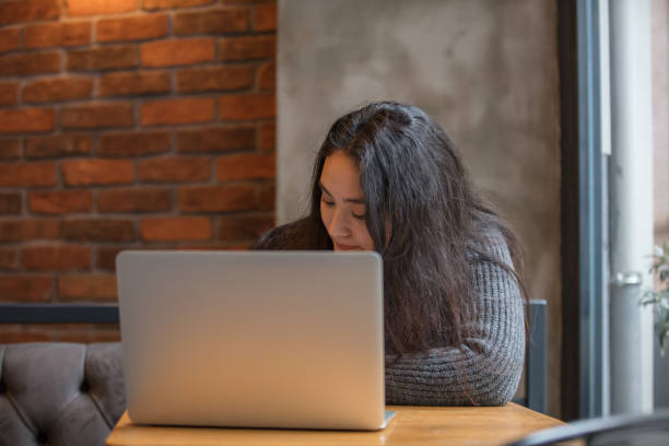 istock Female high school student is studying in coffee shop. 1490537382