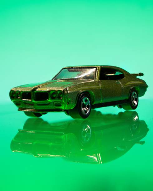 istock Vintage toy car against a green background. 1490538511