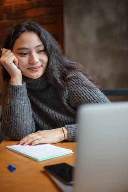 istock Female high school student is studying in coffee shop. 1490538765