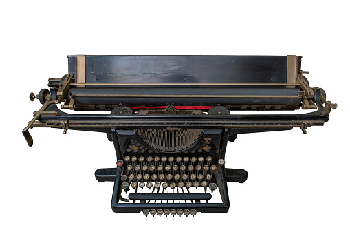 Vintage mechanical typewriter from the past isolated against a white background