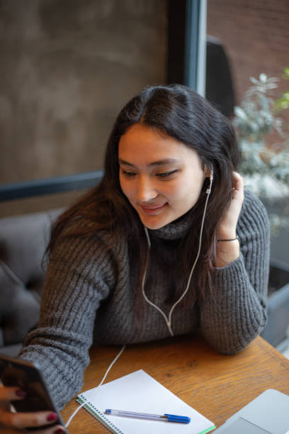 istock Young girl is talking with someone on her mobile phone. 1490541979