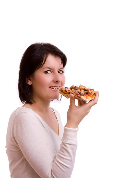istock Attractive woman esting a piece of pizza. 149054232