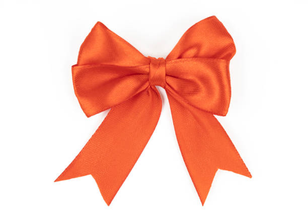 istock Red satin ribbon bow isolated on white background, close up. 1490542502