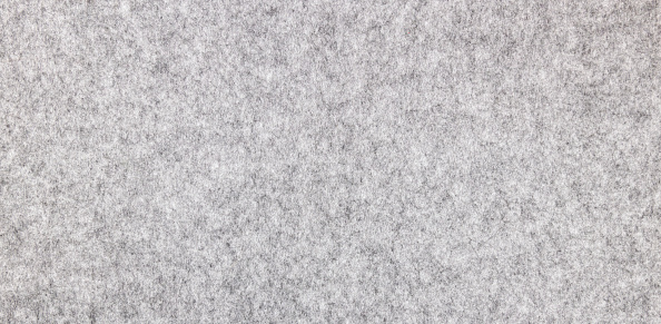Light gray felt with a natural texture. Fabric surface texture, banner