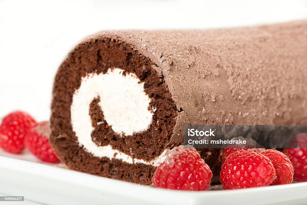 Chocolate Roulade Chocolate Roulade with White Filling and Raspberries Swiss Roll Stock Photo