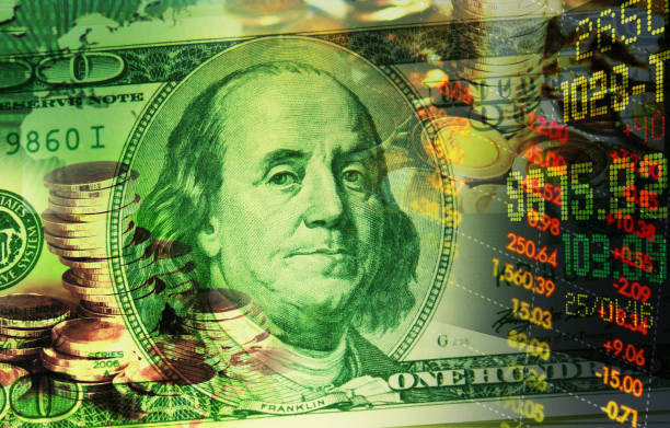 istock One hundred dollar bill Selective focus, Financial data on a monitor finance data concept, Working and Marketing Concept. 1490544508