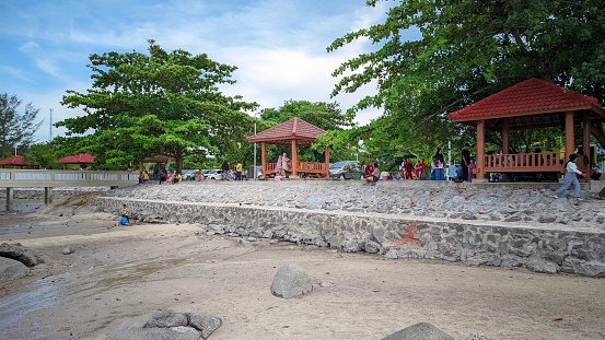 Belinyu , Bangka - 23 April 2023 : filling weekend days by traveling to the beach on Bangka Belitung Island enjoying the beautiful scenery and atmosphere by the sea
