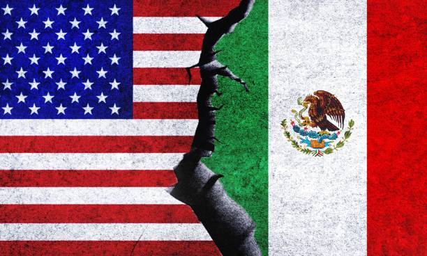 istock USA and Mexico flag together. USA Mexico conflict 1490552159