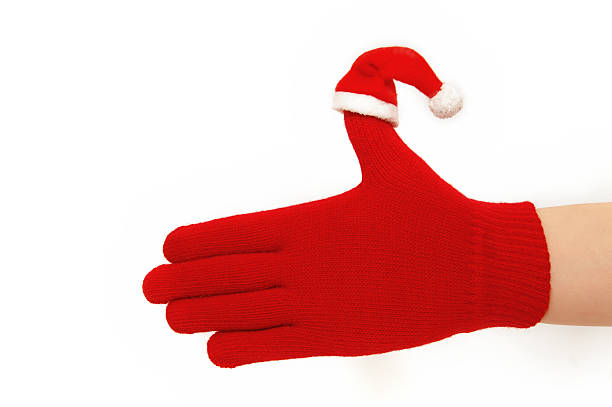 istock Hand with santa hat. Isolated on white. 149055337
