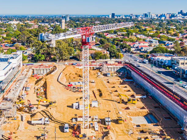 Aerial view Burnside Village construction site, tower crane & equipment in Adelaide's Eastern suburbs