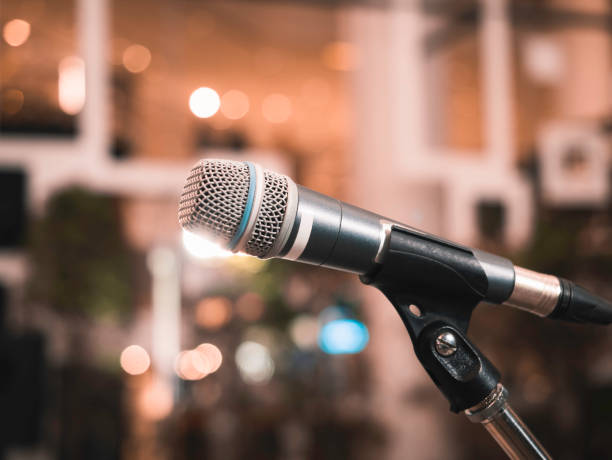 istock Microphone on stage Concert Entertainment event 1490556863