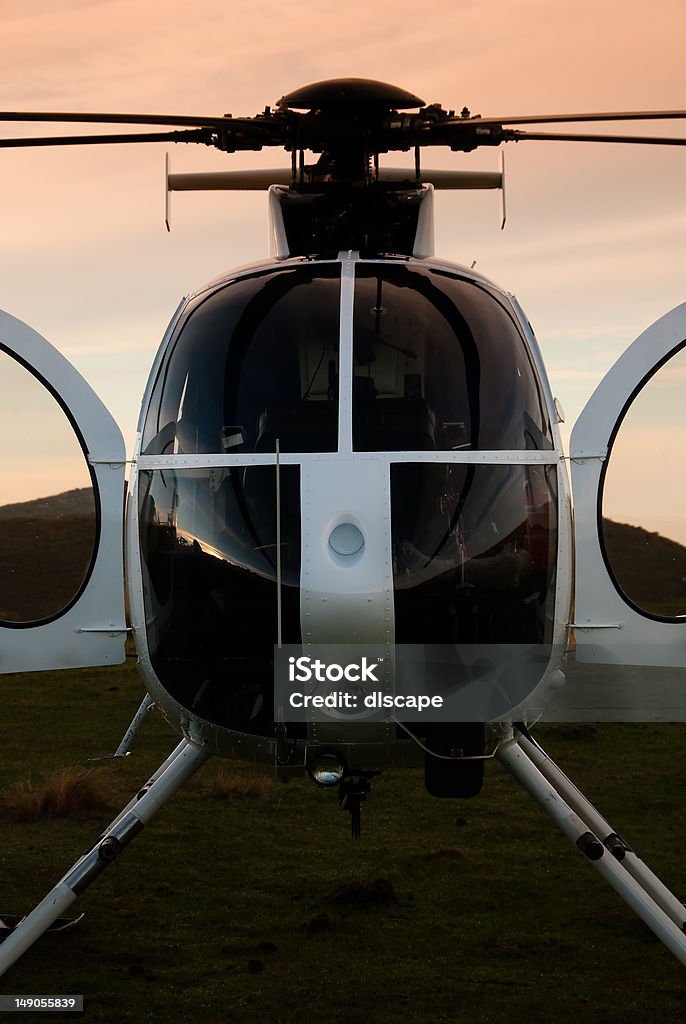 Stationary helicopter at dawn Landed helicopter waiting for shepherds to board. They were then flown to the snow line of Mount Linton to muster cattle. Helicopter Stock Photo