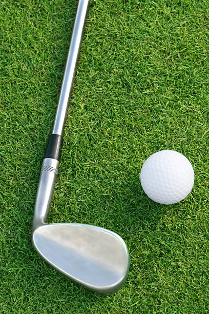 istock Golf Ball And Club On The Green 149055910