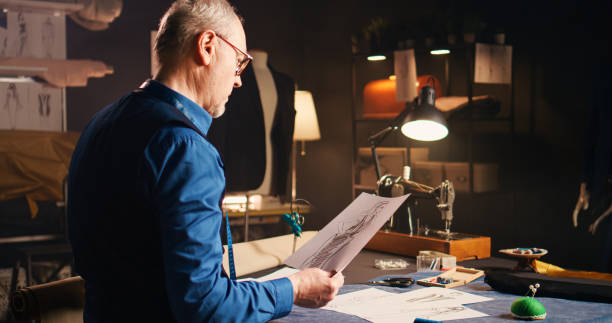 istock Senior designer looking at sketches 1490560780