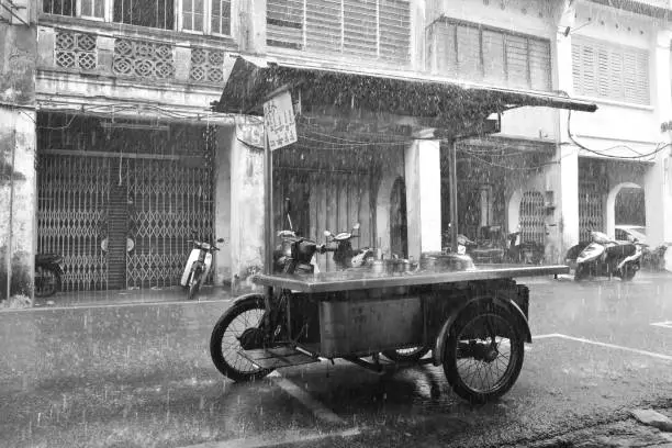 a sudden tropical rain offered this nice view of a streetfood motorcycle in Georgetown, Penang, Malaysia