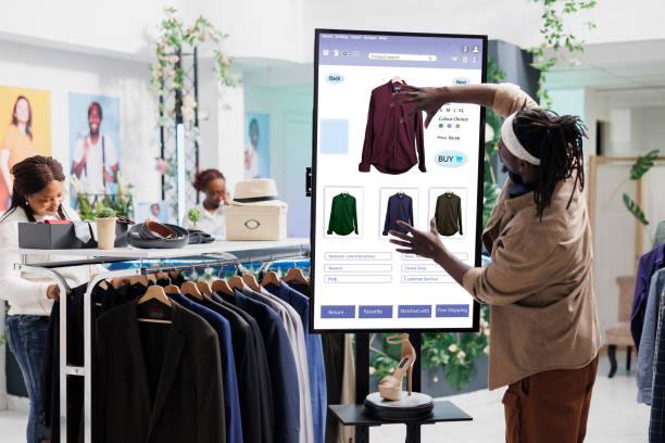 istock Male customer using clothing store kiosk 1490563604