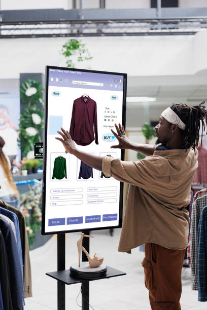 istock Online store buyer looks for clothes 1490563760