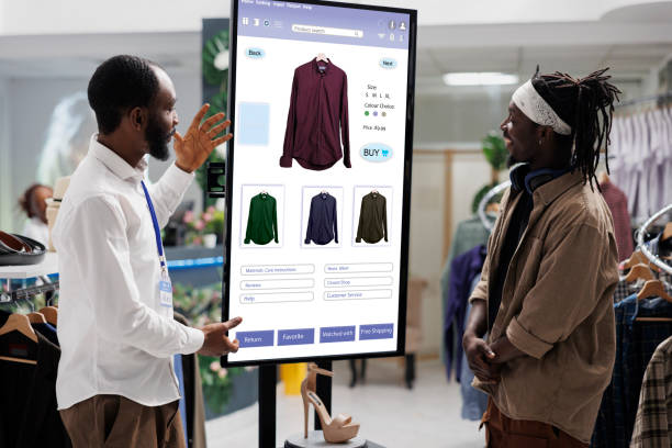 istock People look at clothing kiosk service 1490563829