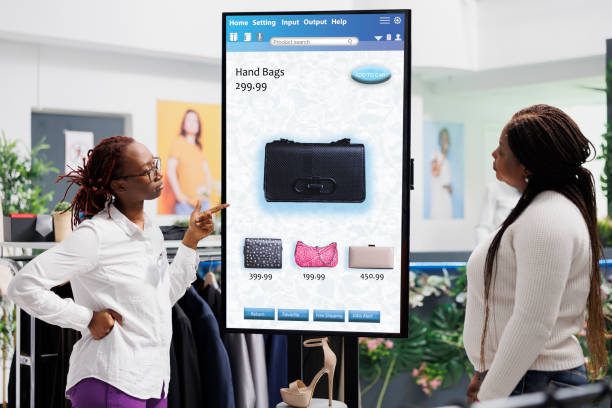 istock Store assistant showing items to woman 1490564074