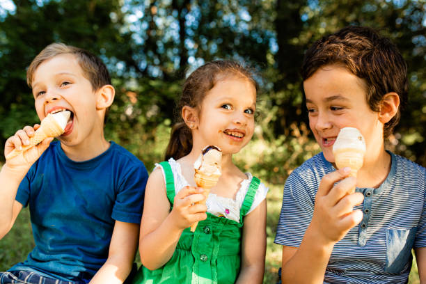istock Children eating ice cream in the park 1490564188