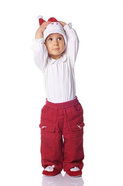 Baby in red hat stock photo